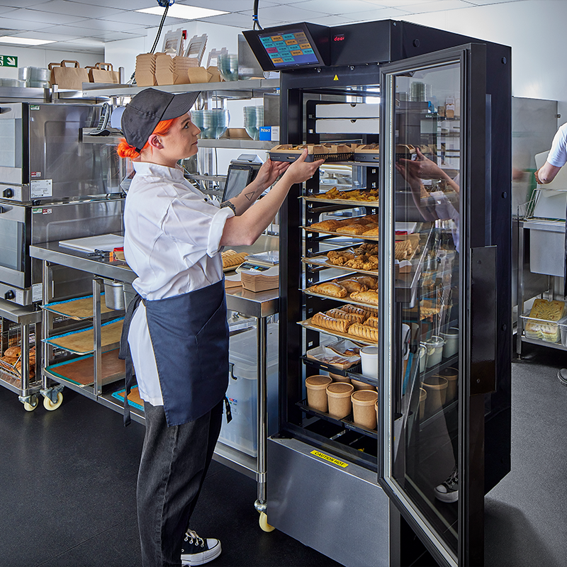 Staff member uses Flexeserve Hub in kitchen